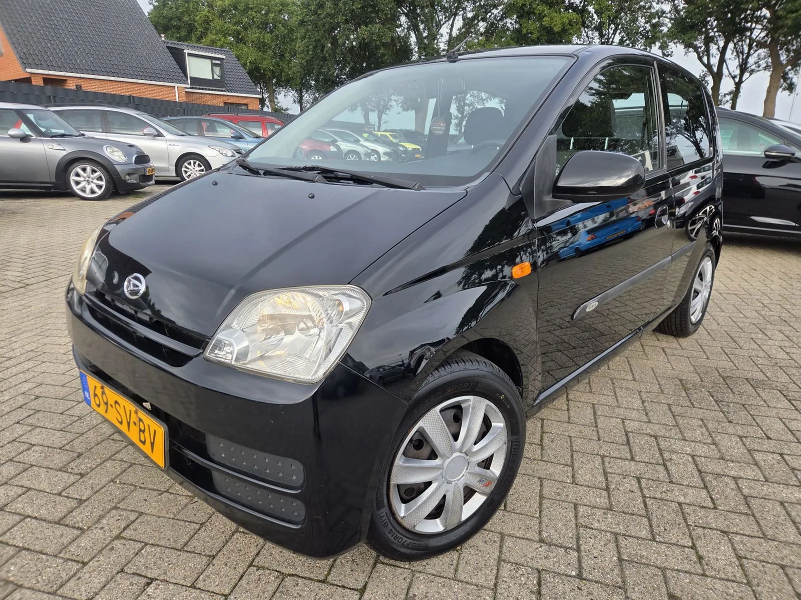Daihatsu Cuore (2006) — foto 1