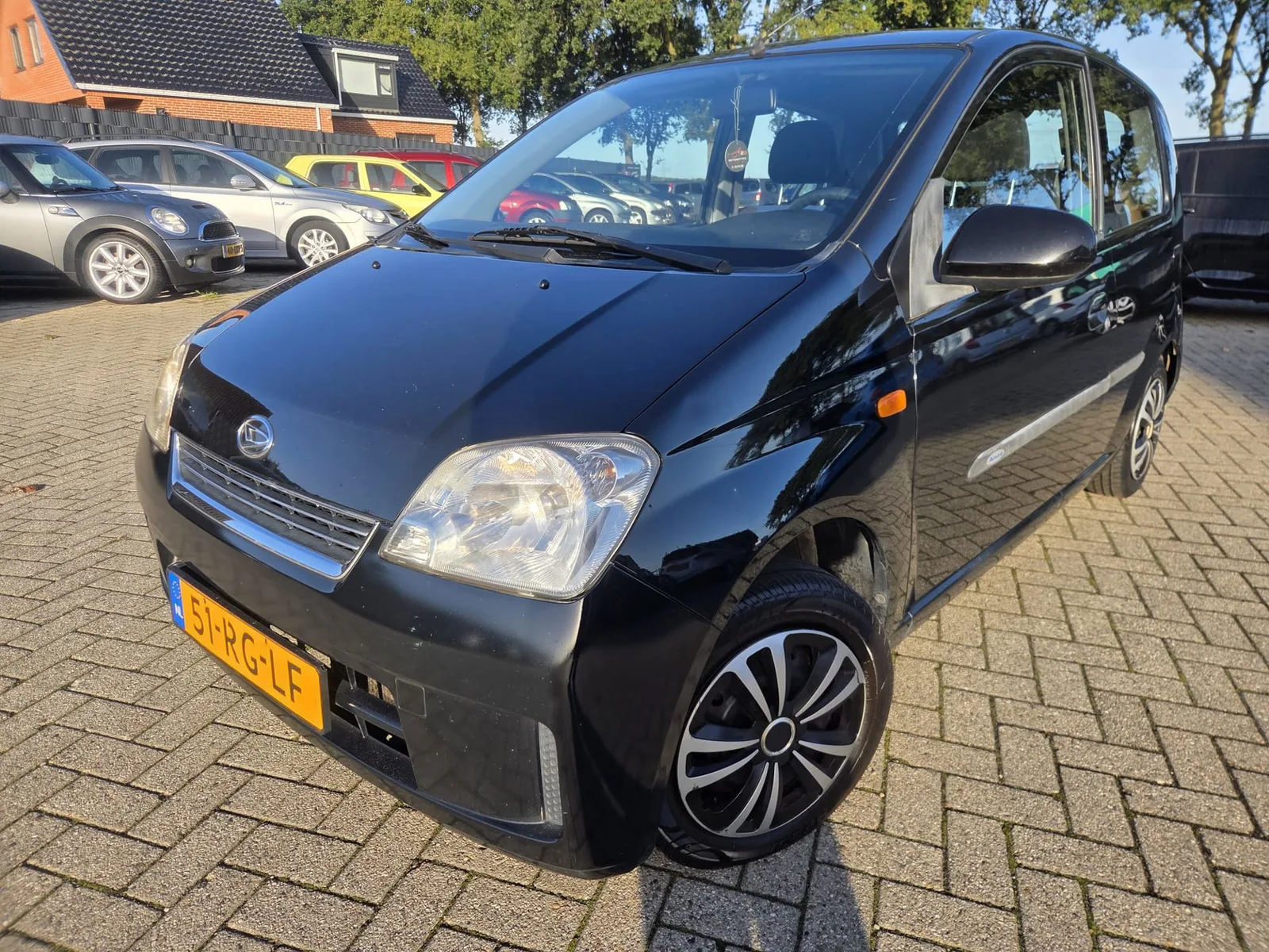 Daihatsu Cuore (2005) — foto 1