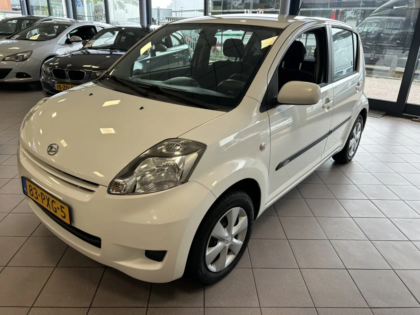 Daihatsu Sirion (2011) — foto 1