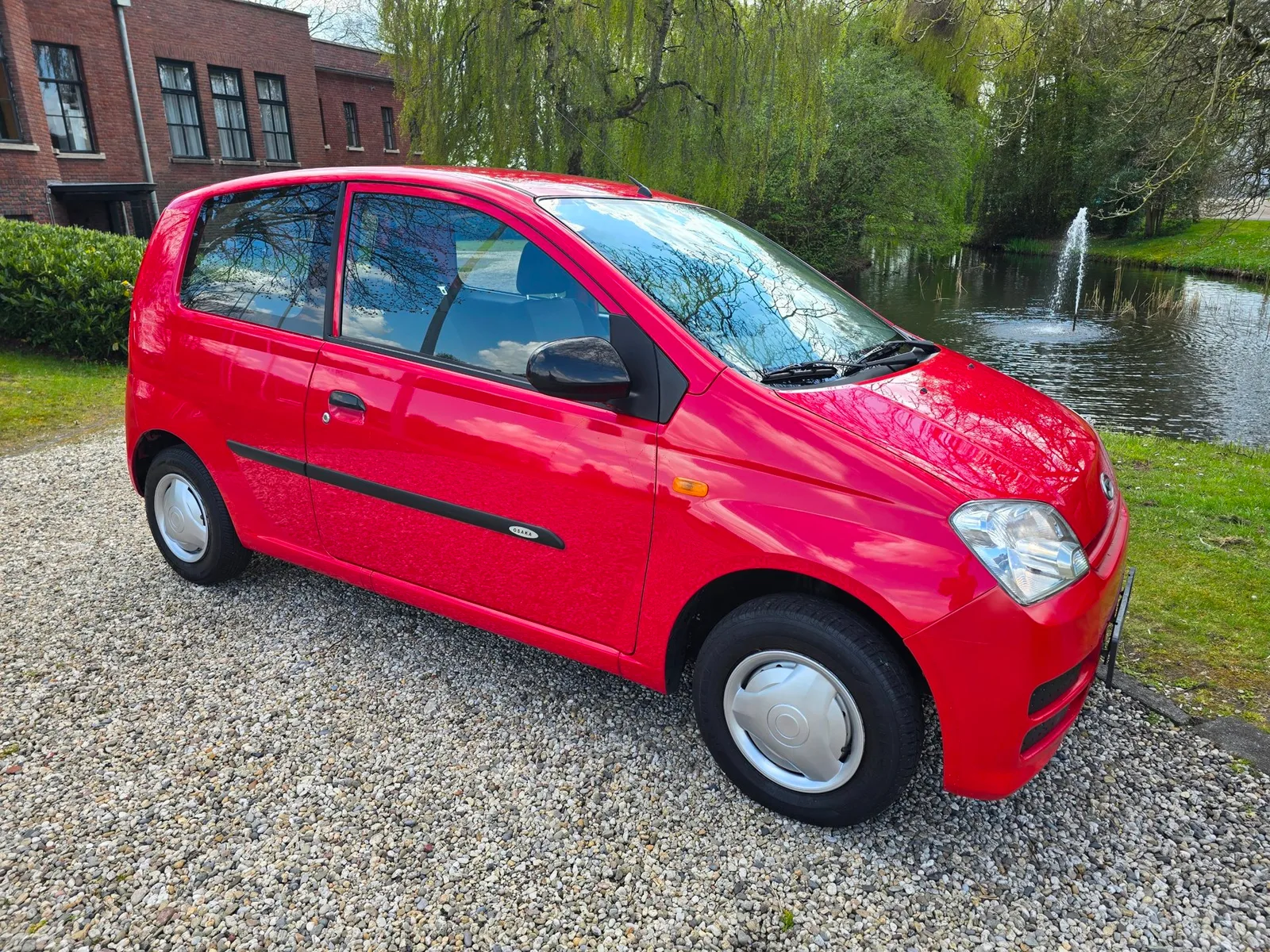 Daihatsu Cuore (2006) — foto 1