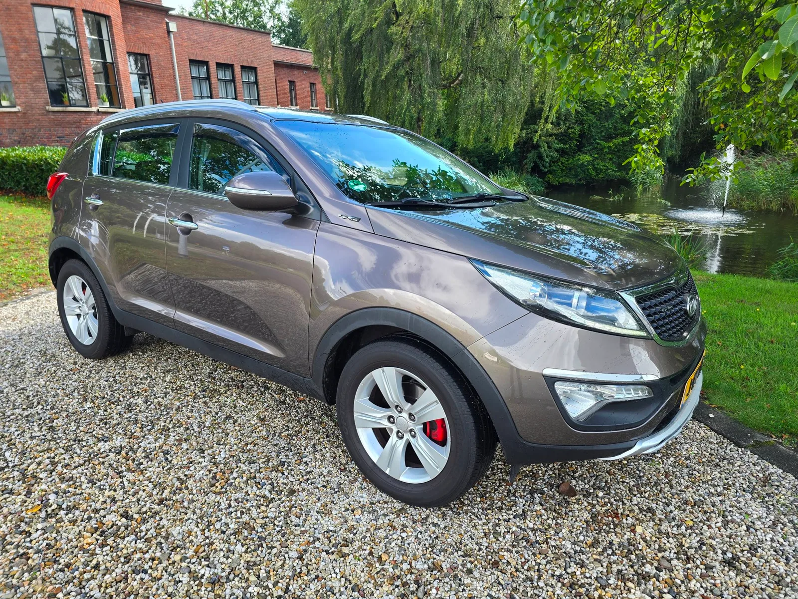 Kia Sportage (2012) — foto 1