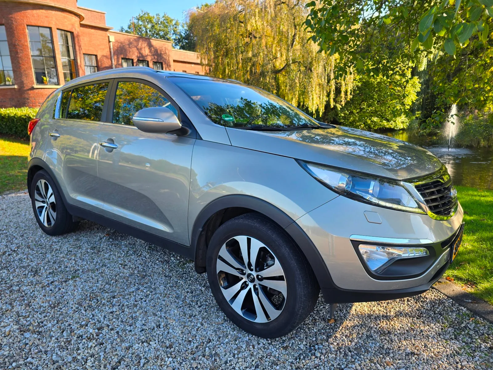 Kia Sportage (2012) — foto 1