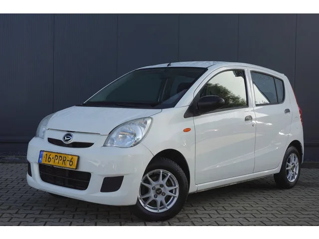 Daihatsu Cuore (2011) — foto 1