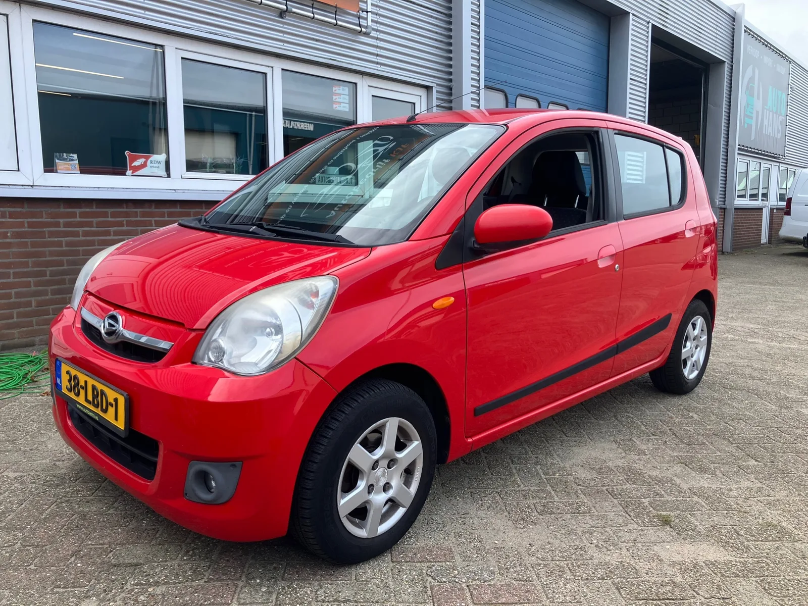 Daihatsu Cuore (2010) — foto 1