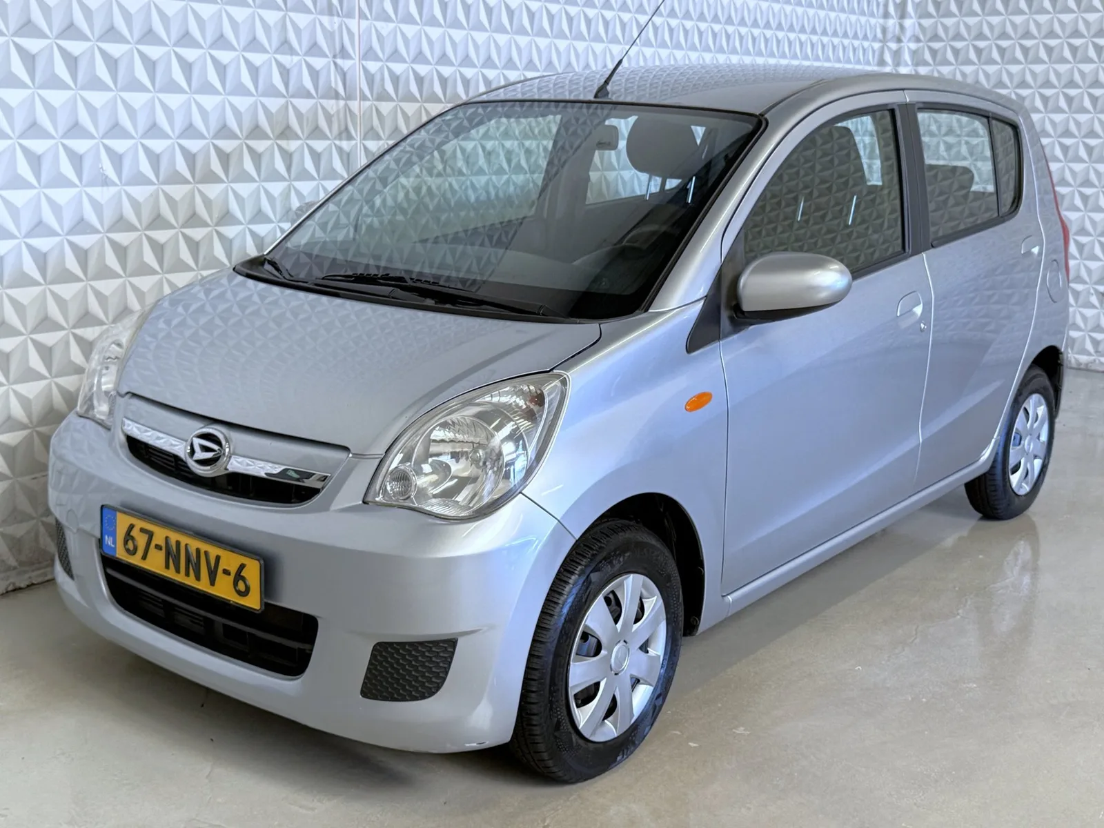 Daihatsu Cuore (2007) — foto 1