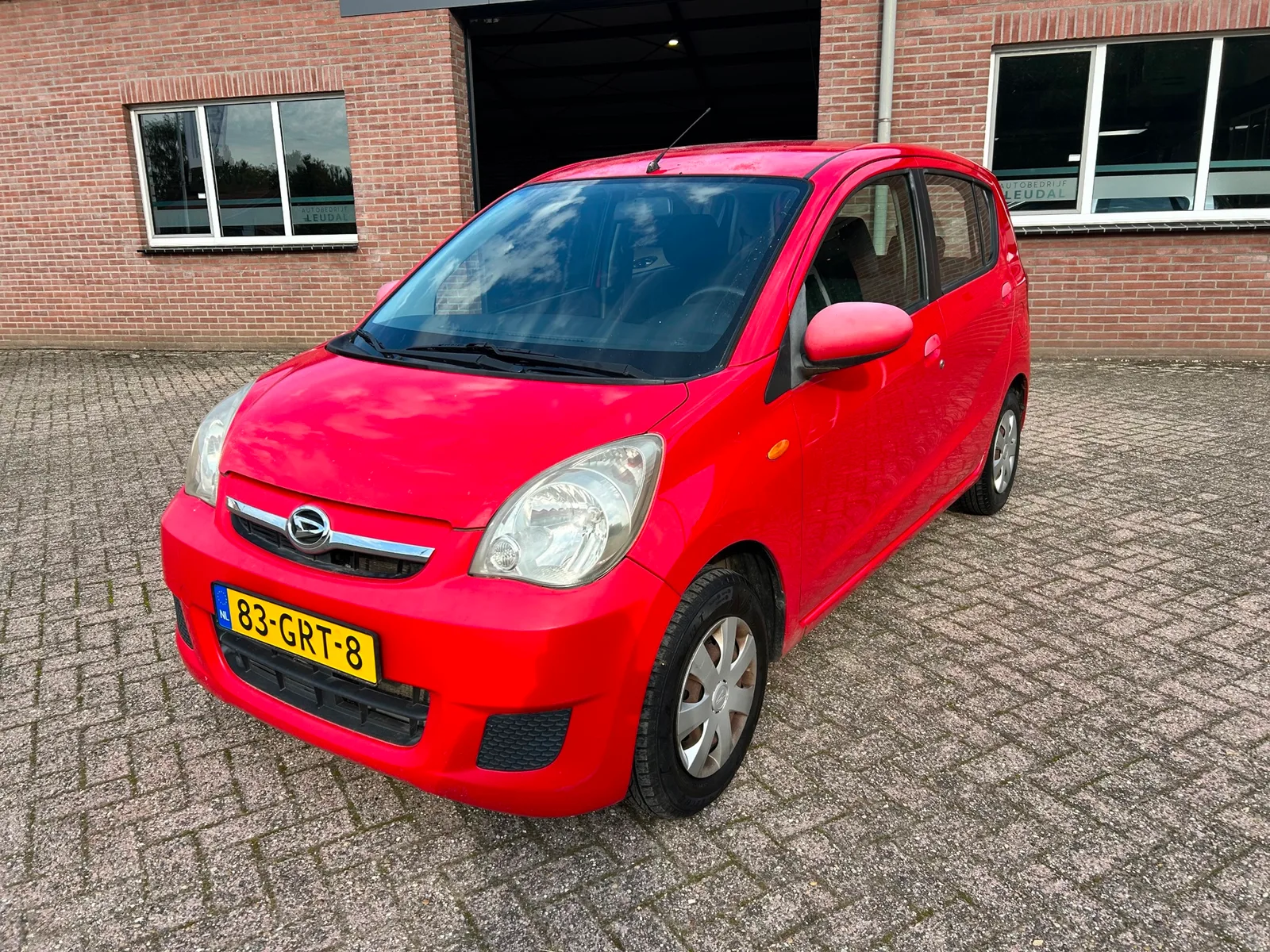 Daihatsu Cuore (2008) — foto 1