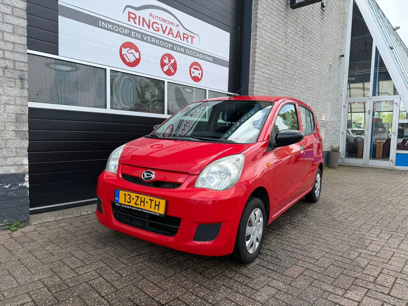 Daihatsu Cuore (2008) — foto 1