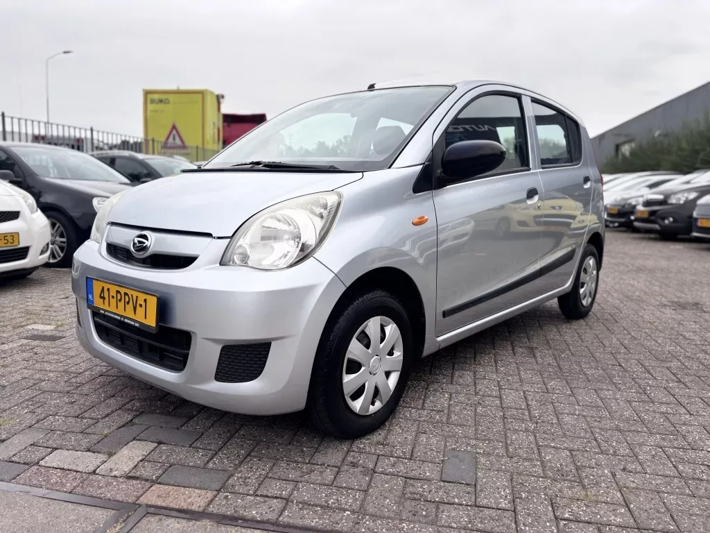 Daihatsu Cuore (2011) — foto 1