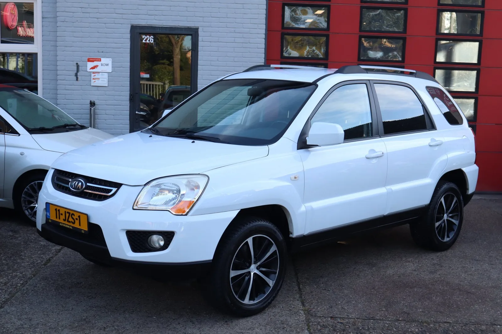Kia Sportage (2009) — foto 1