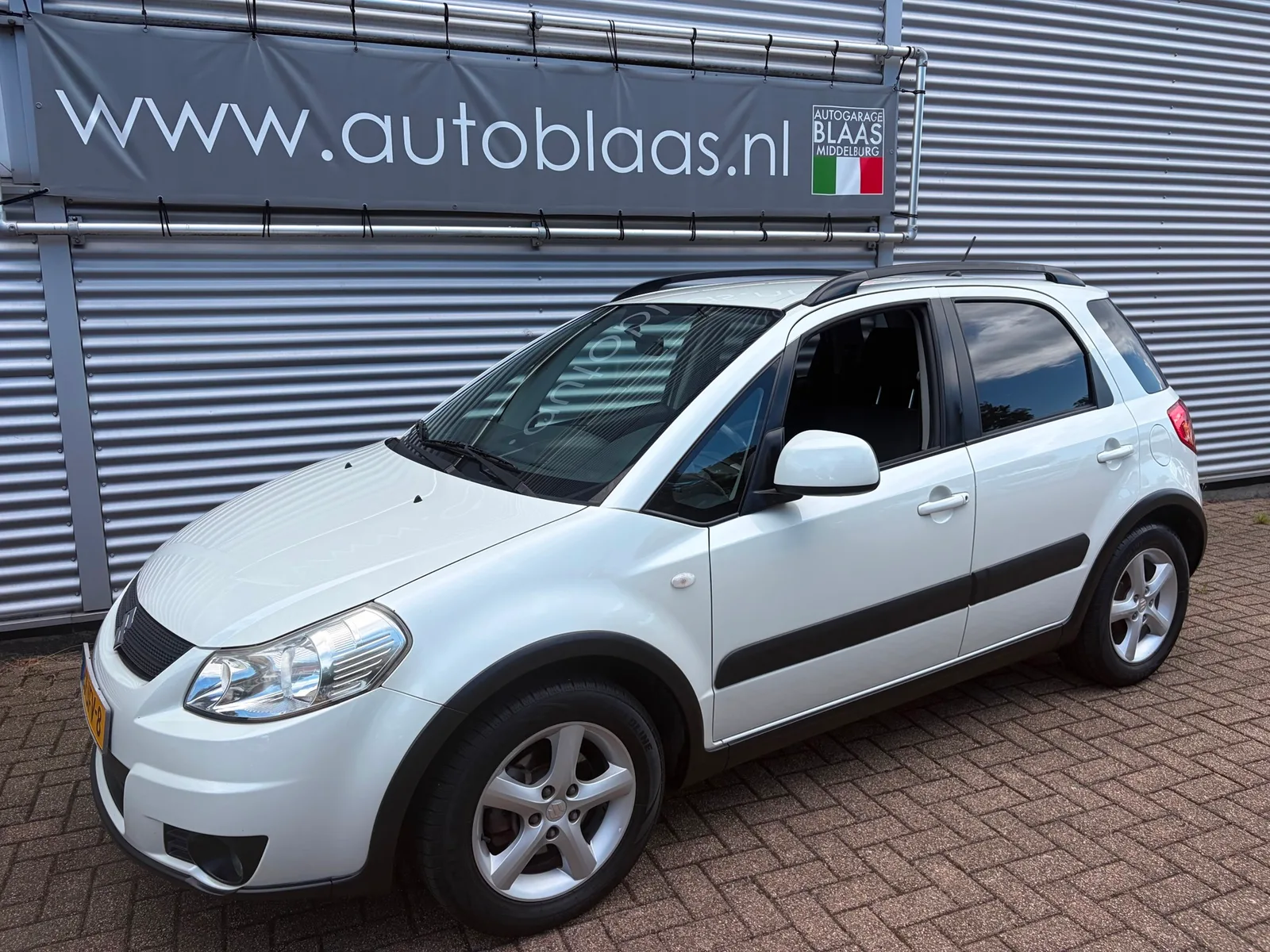 Suzuki SX4 (2009) — foto 1