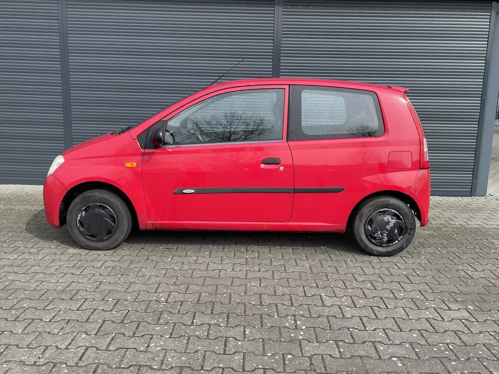 Daihatsu Cuore (2004) — foto 1