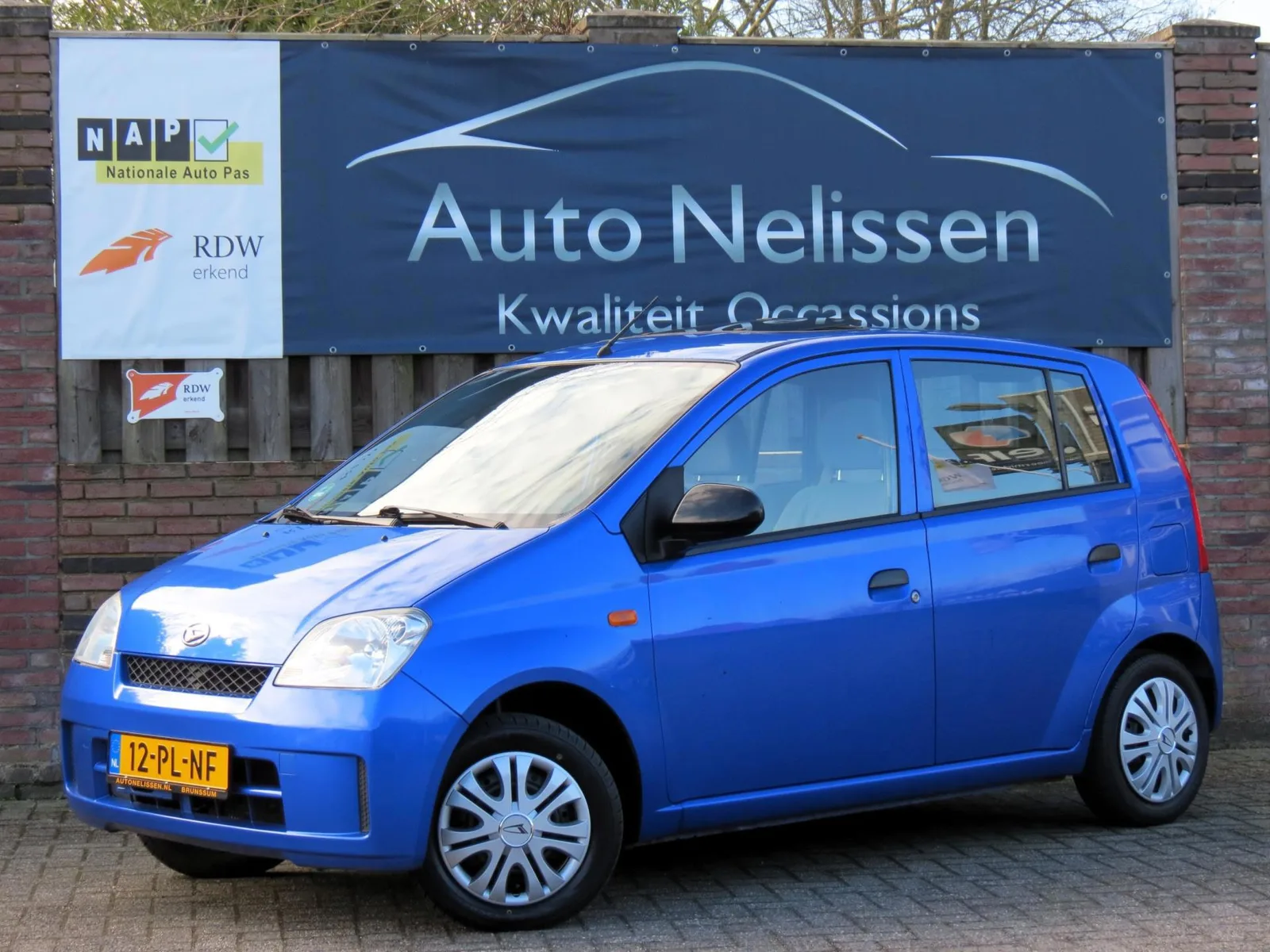 Daihatsu Cuore (2004) — foto 1