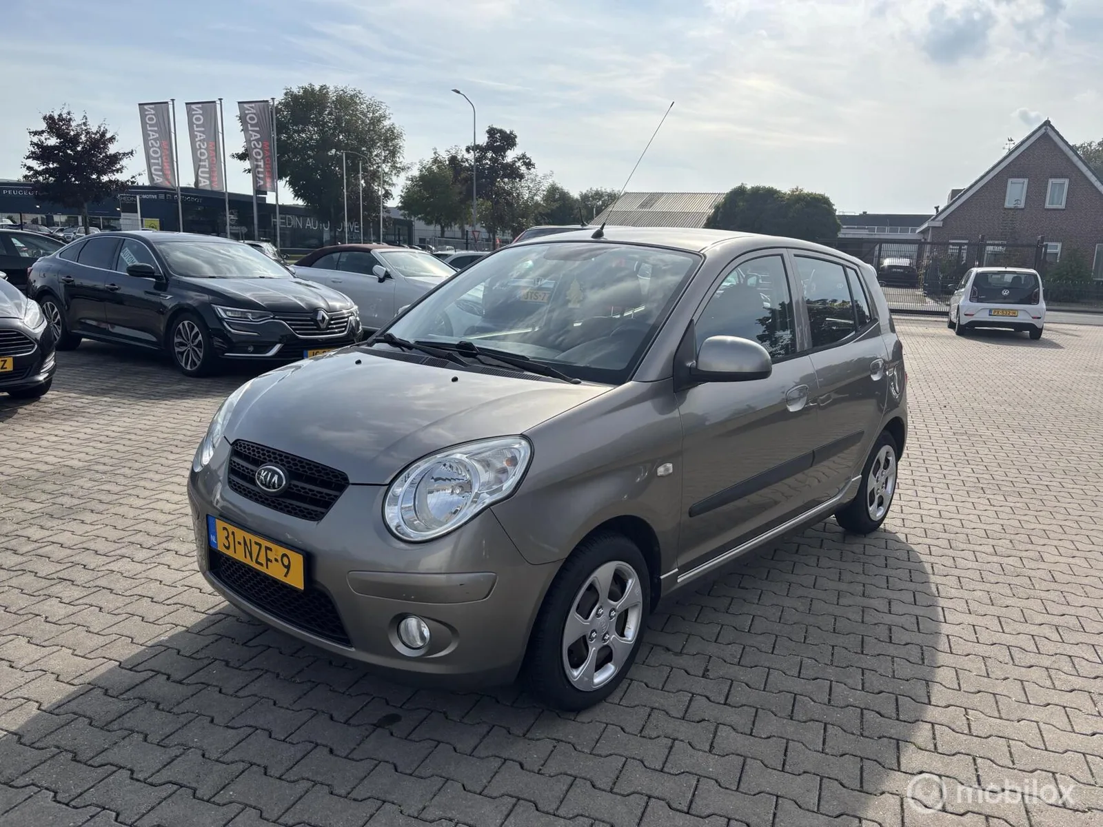 Kia Picanto (2011) — foto 1