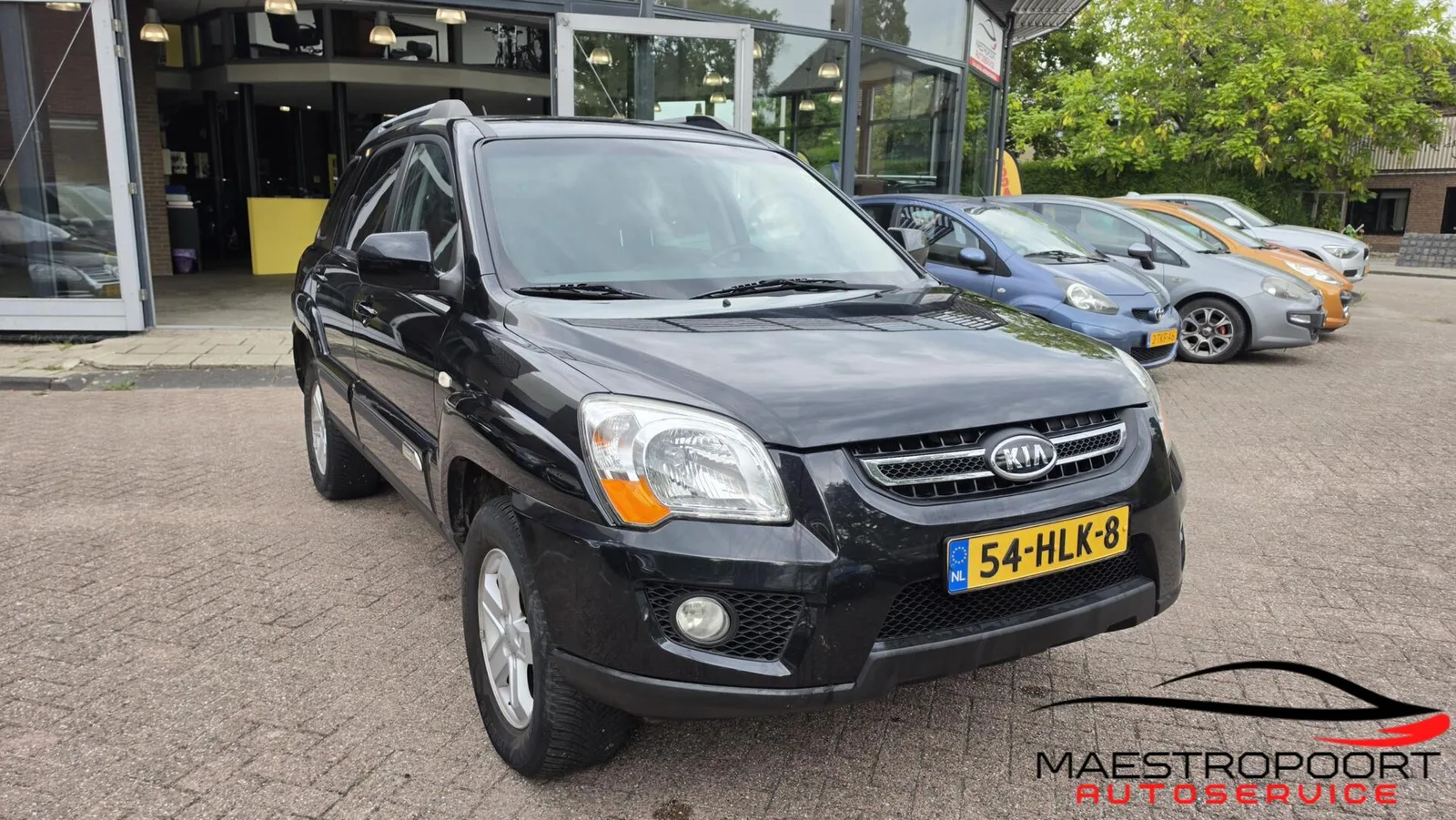 Kia Sportage (2009) — foto 1