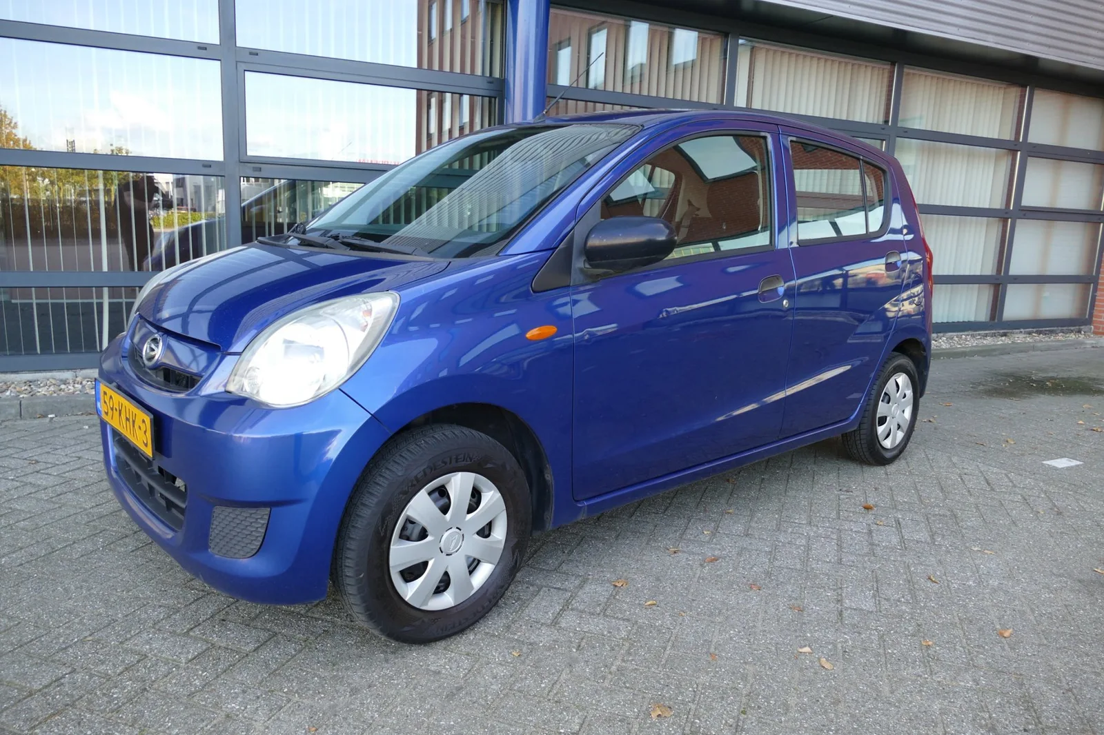 Daihatsu Cuore (2009) — foto 1