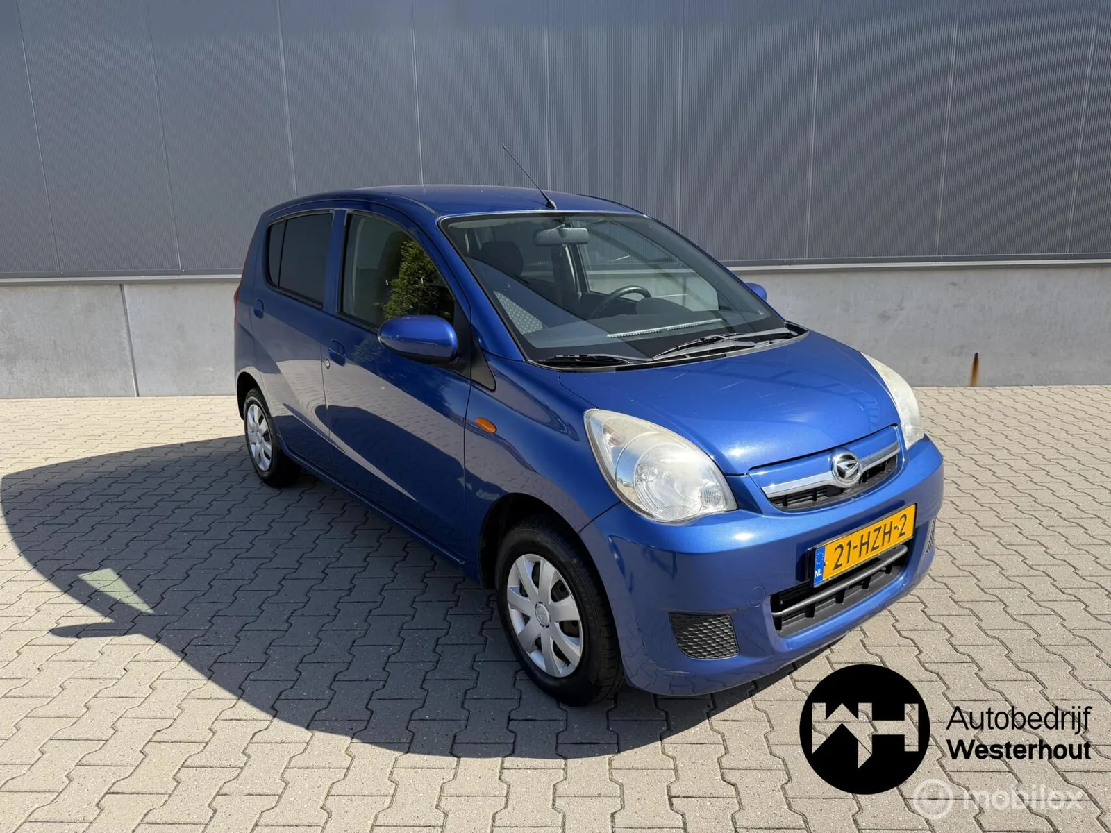 Daihatsu Cuore (2009) — foto 1