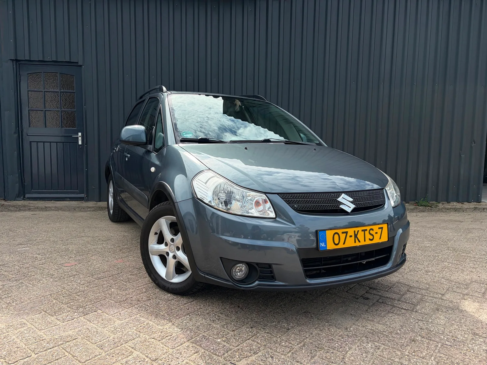 Suzuki SX4 (2010) — foto 1