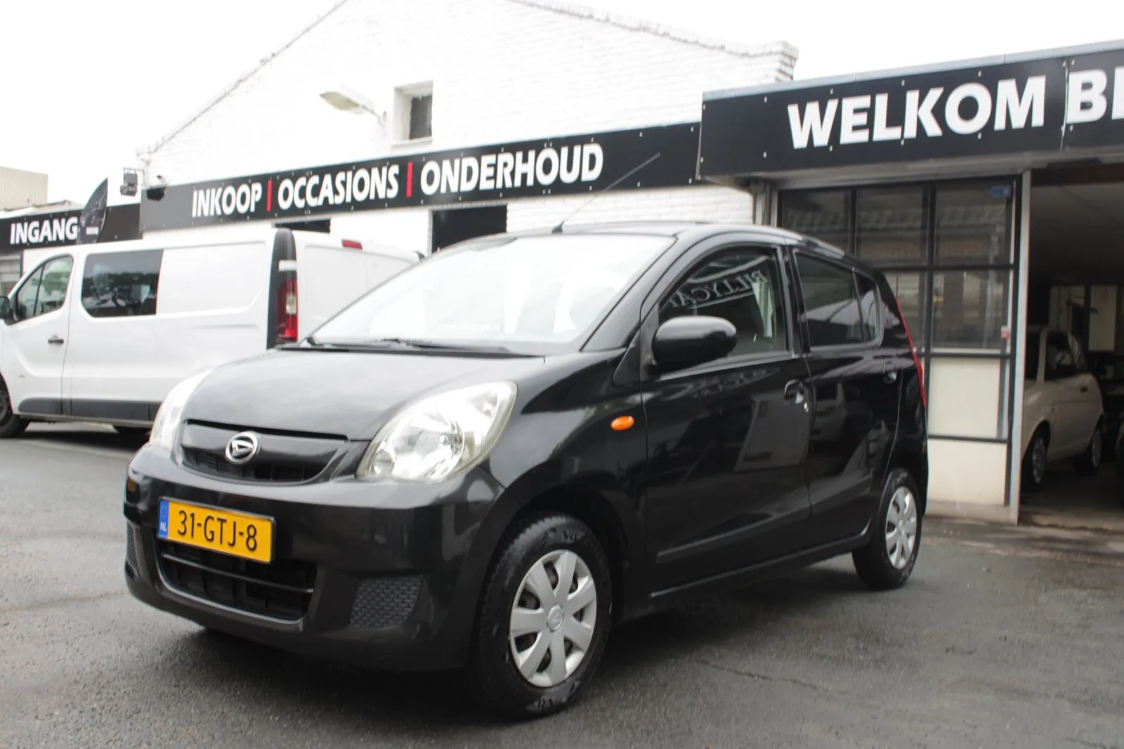 Daihatsu Cuore (2008) — foto 1