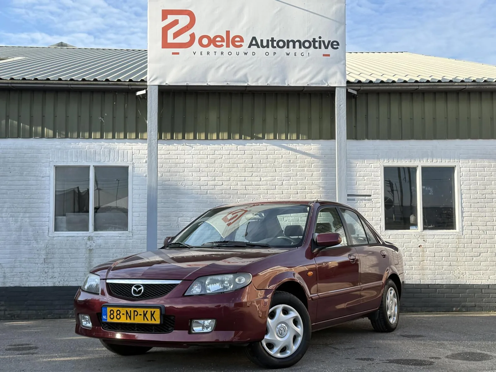Mazda 323 (2004) — foto 1