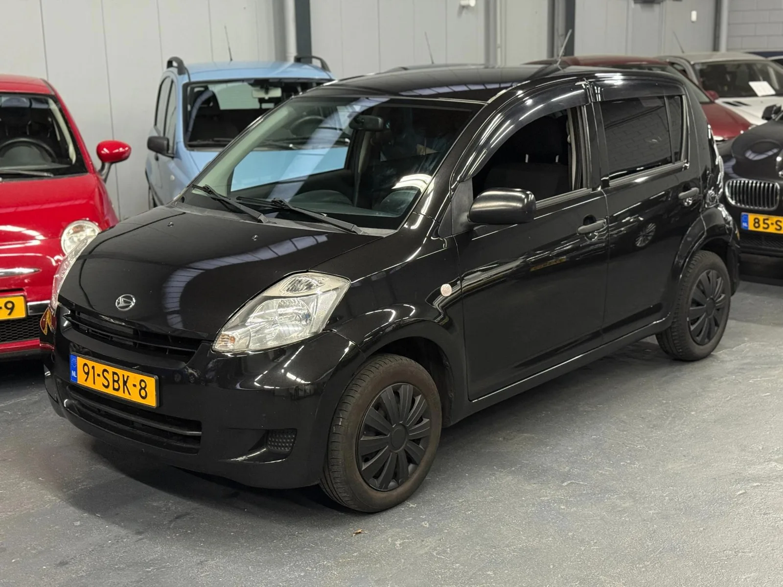 Daihatsu Sirion (2011) — foto 1