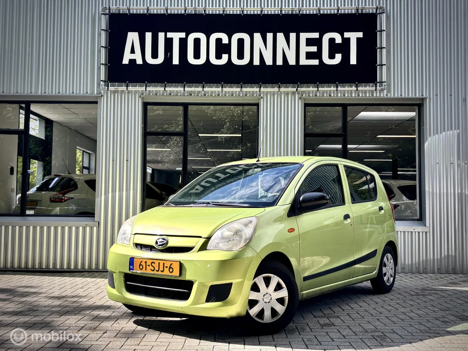 Daihatsu Cuore (2011) — foto 1