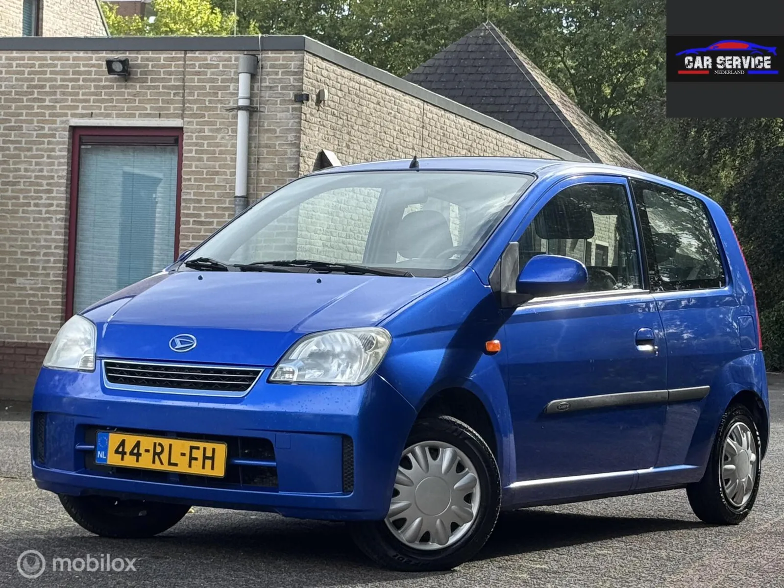 Daihatsu Cuore (2005) — foto 1