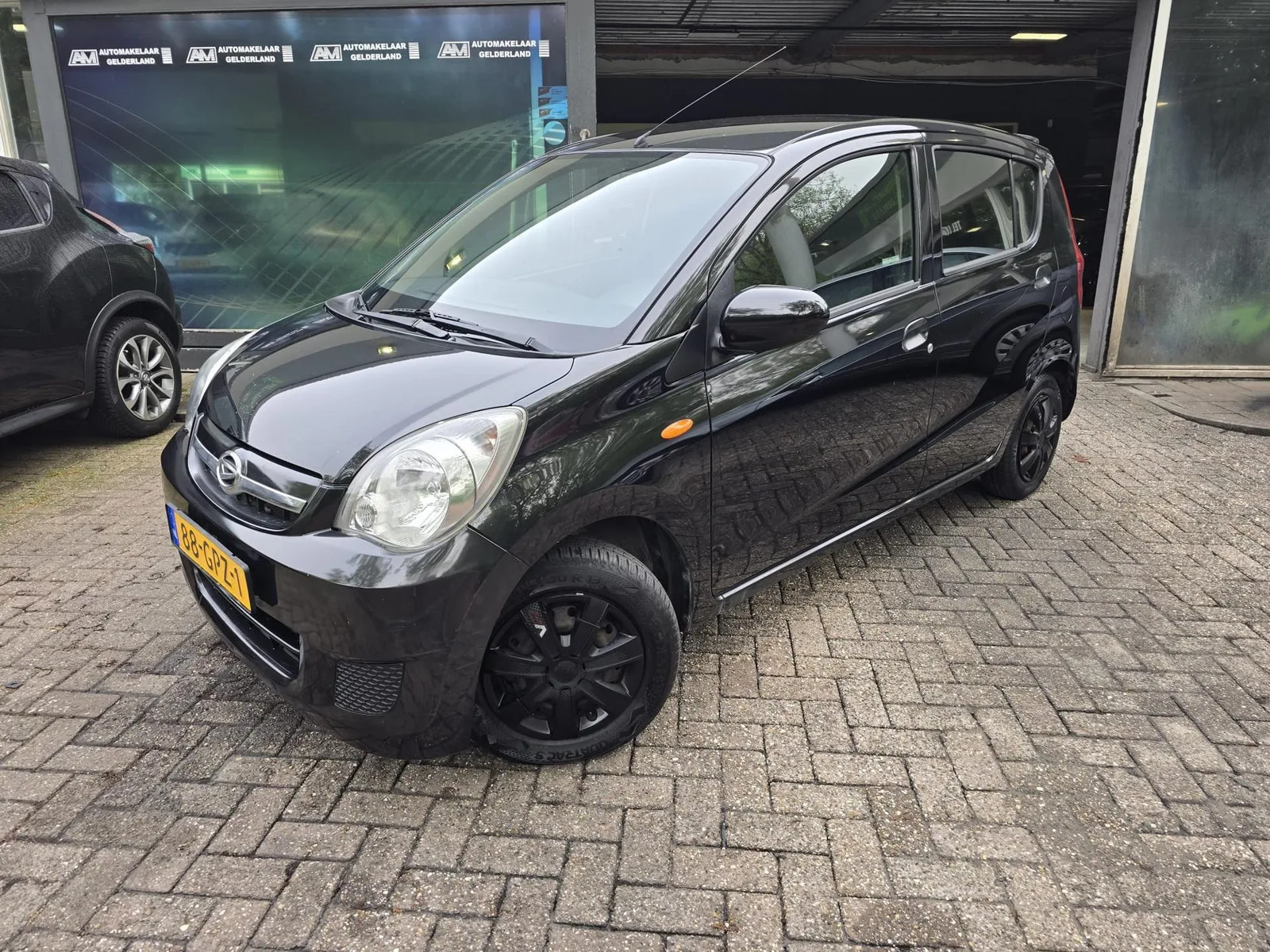 Daihatsu Cuore (2008) — foto 1