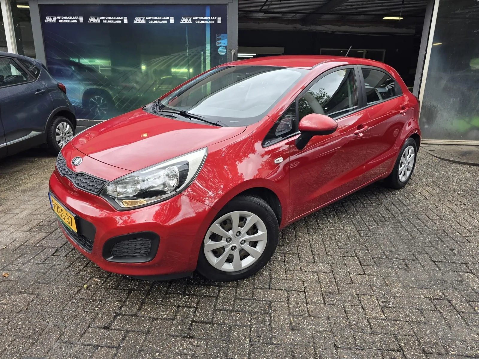 Kia Rio (2015) — foto 1
