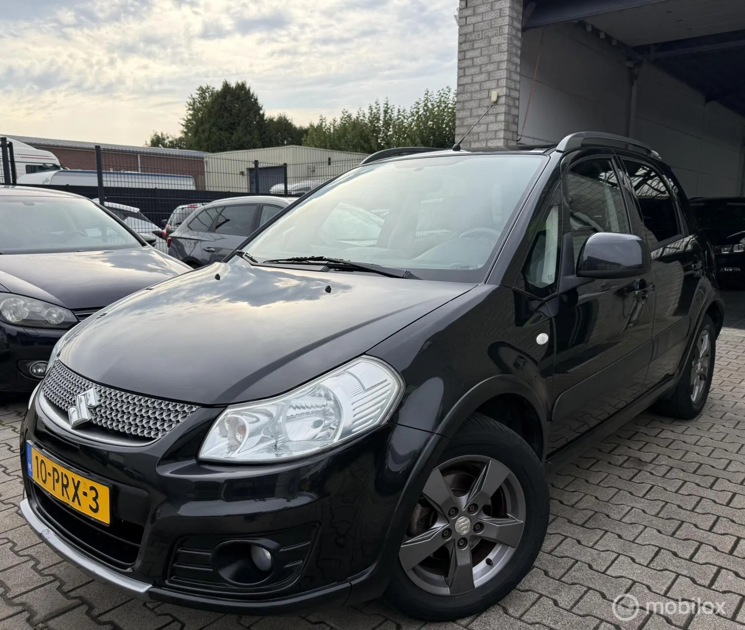 Suzuki SX4 (2011) — foto 1