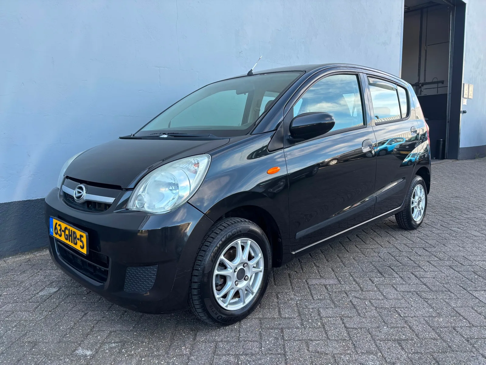 Daihatsu Cuore (2008) — foto 1