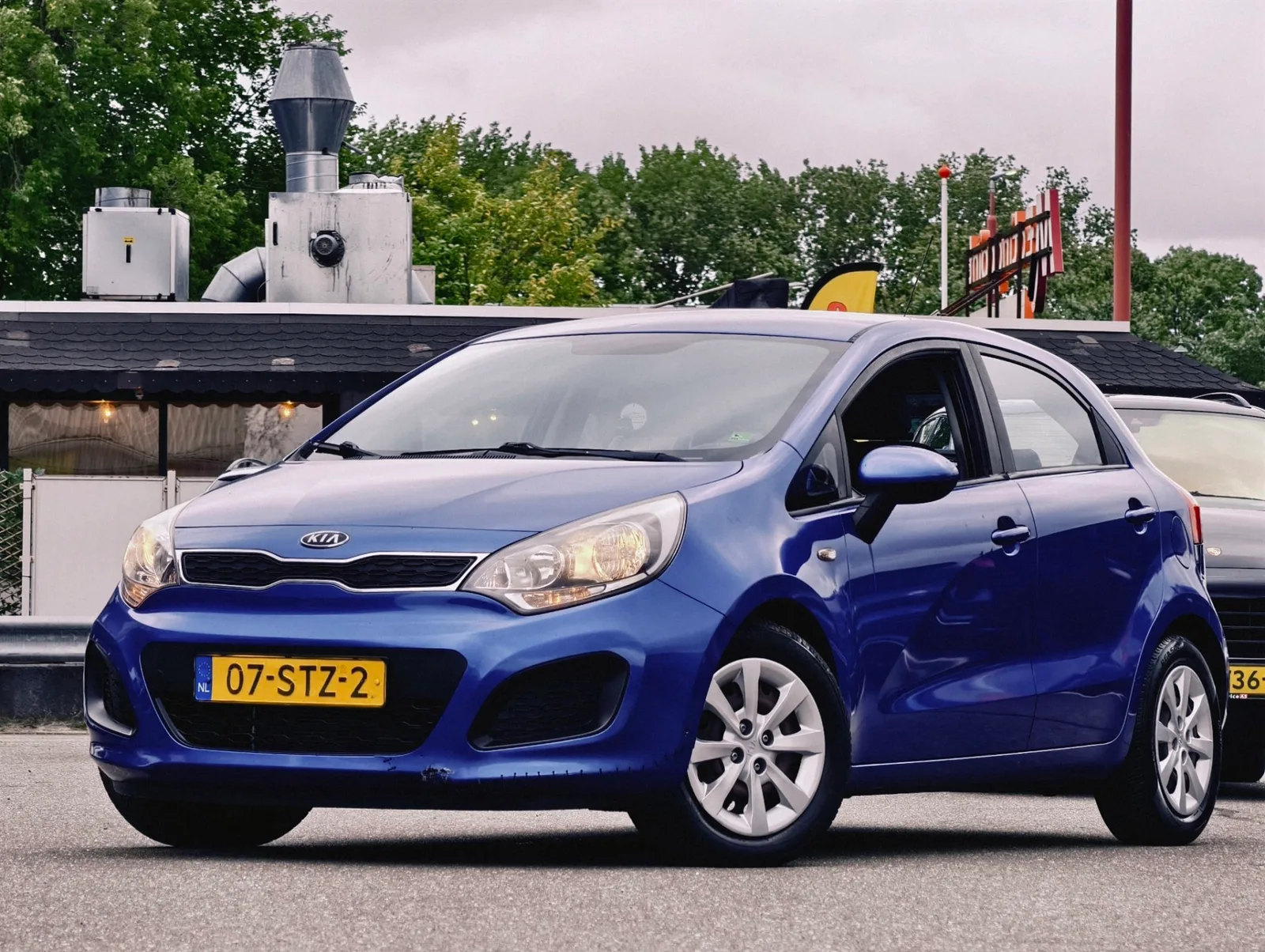 Kia Rio (2011) — foto 1