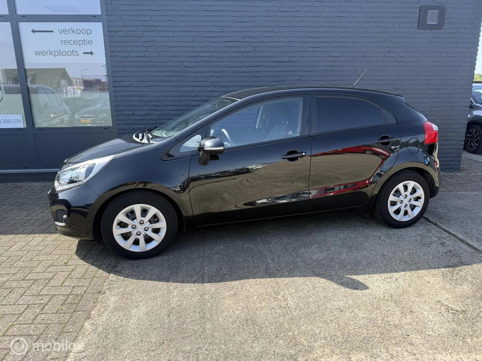 Kia Rio (2014) — foto 1