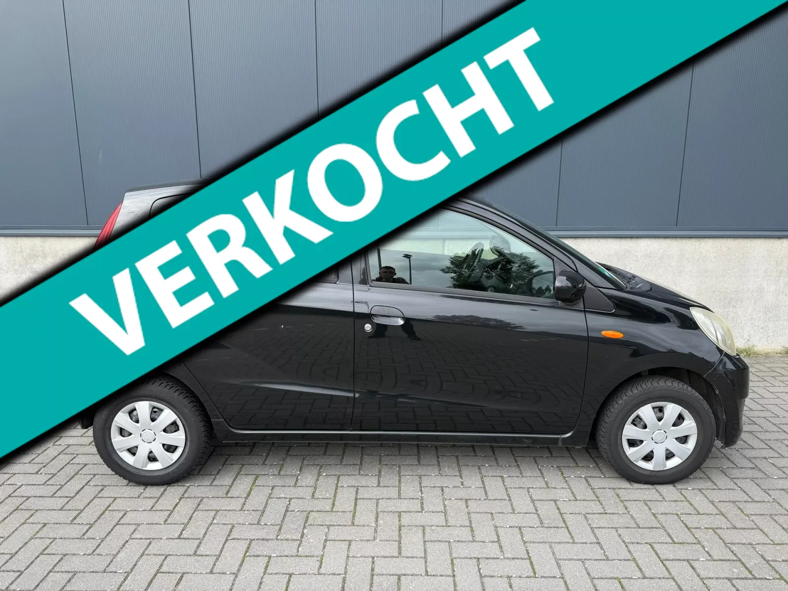 Daihatsu Cuore (2008) — foto 1