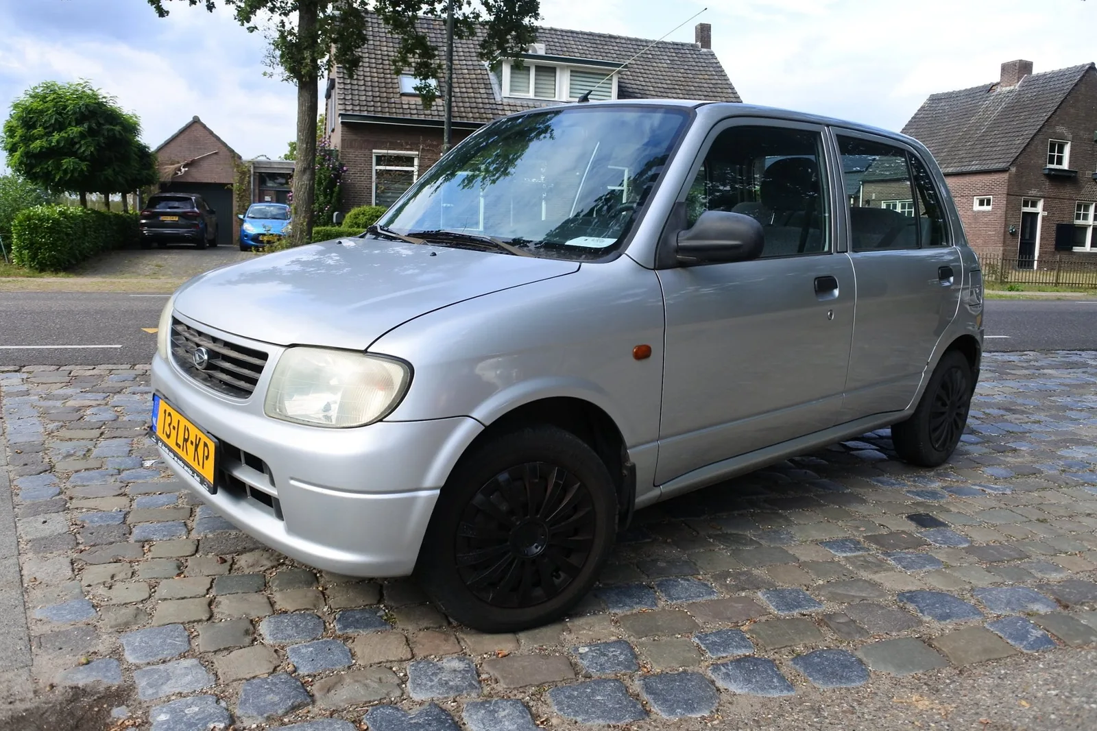 Daihatsu Cuore (2003) — foto 1