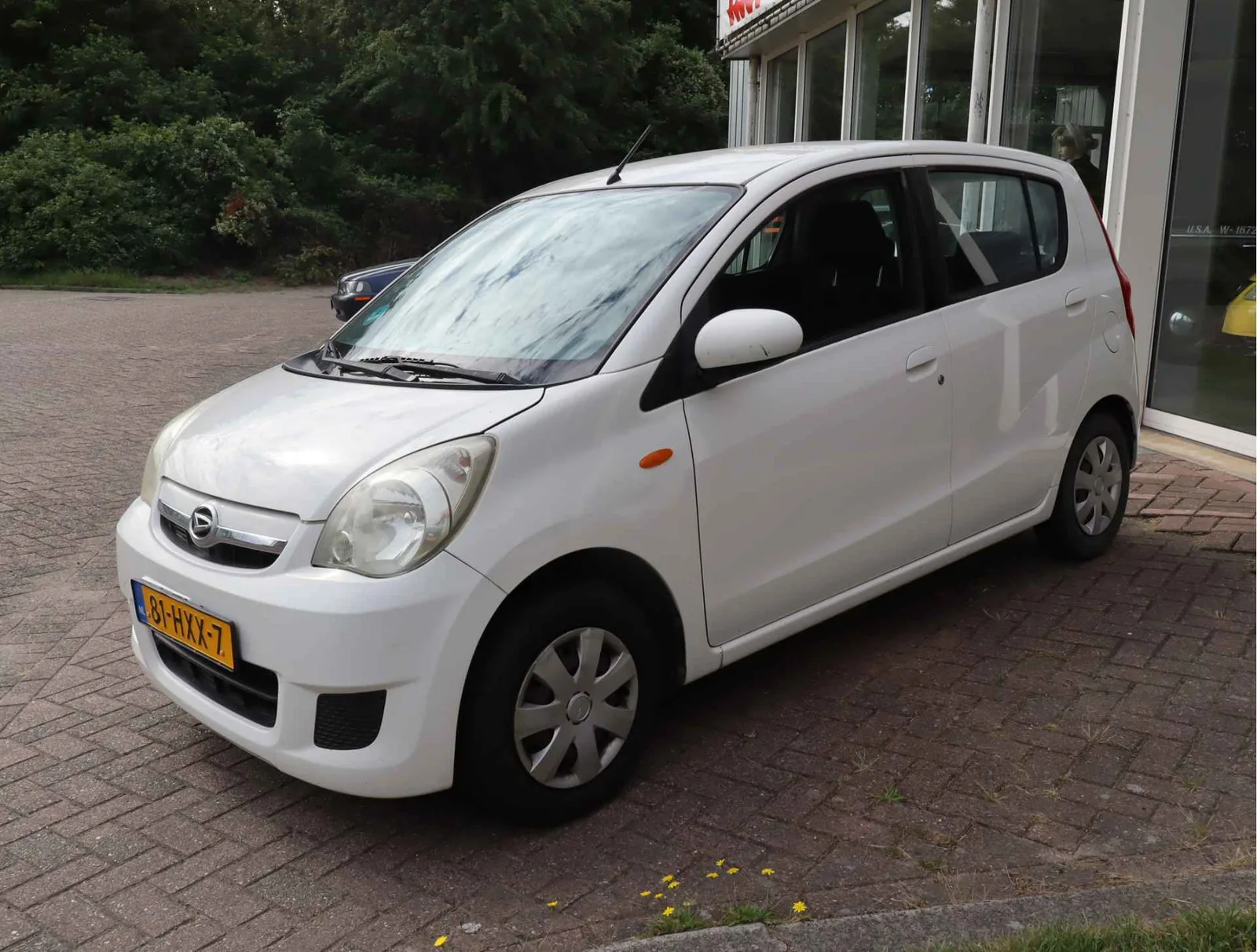 Daihatsu Cuore (2009) — foto 1