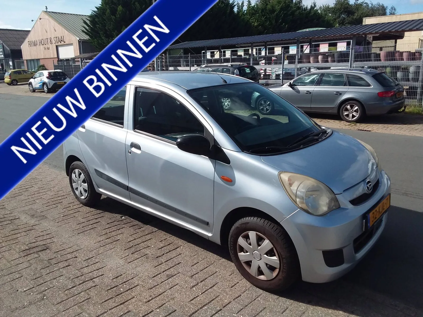 Daihatsu Cuore (2009) — foto 1