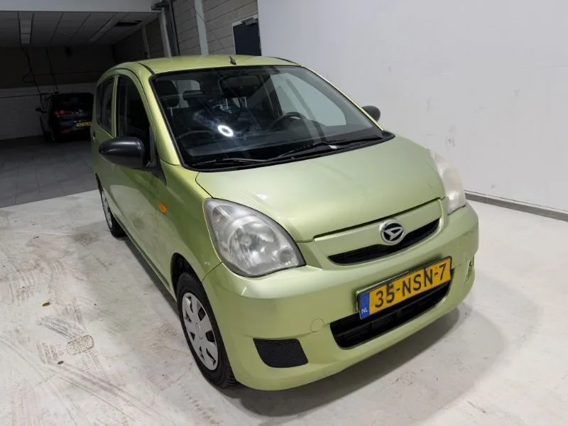 Daihatsu Cuore (2010) — foto 1