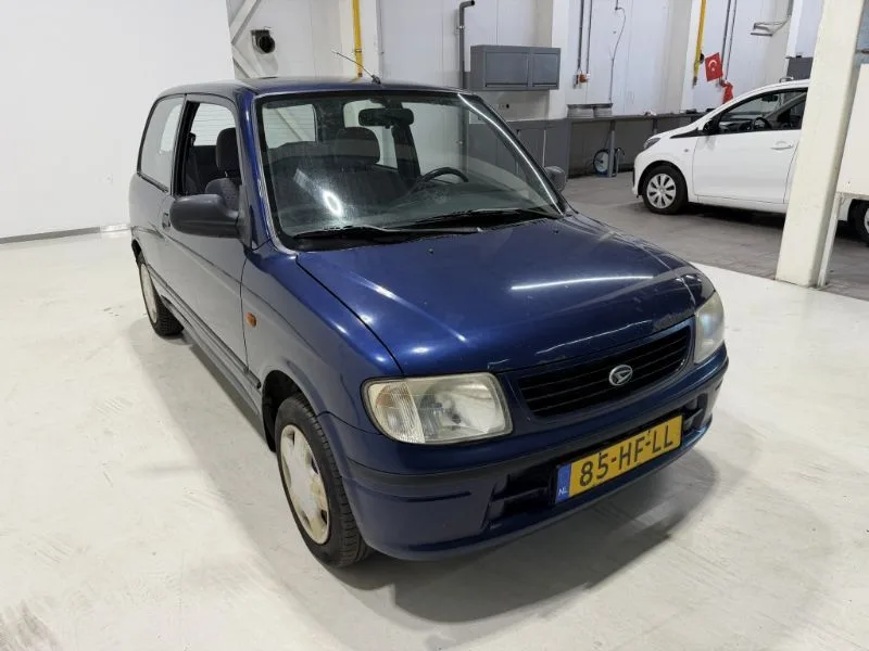Daihatsu Cuore (2001) — foto 1