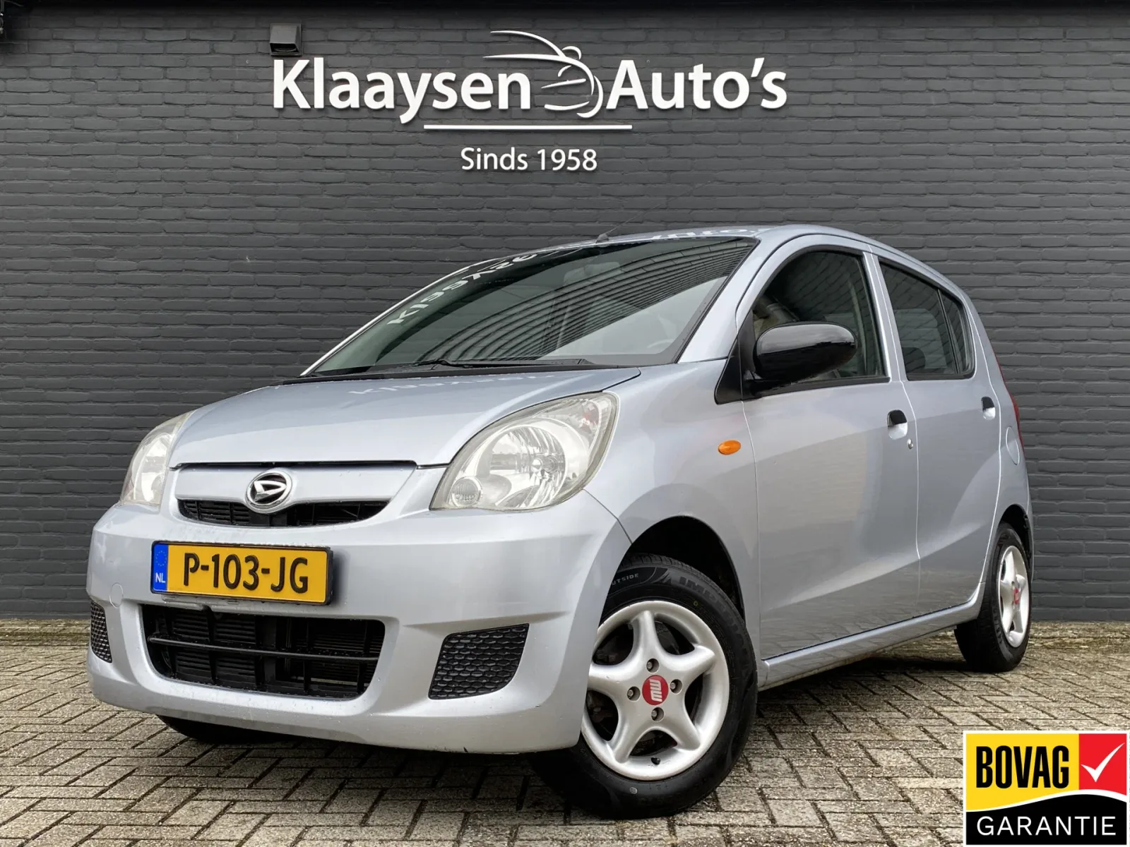 Daihatsu Cuore (2009) — foto 1