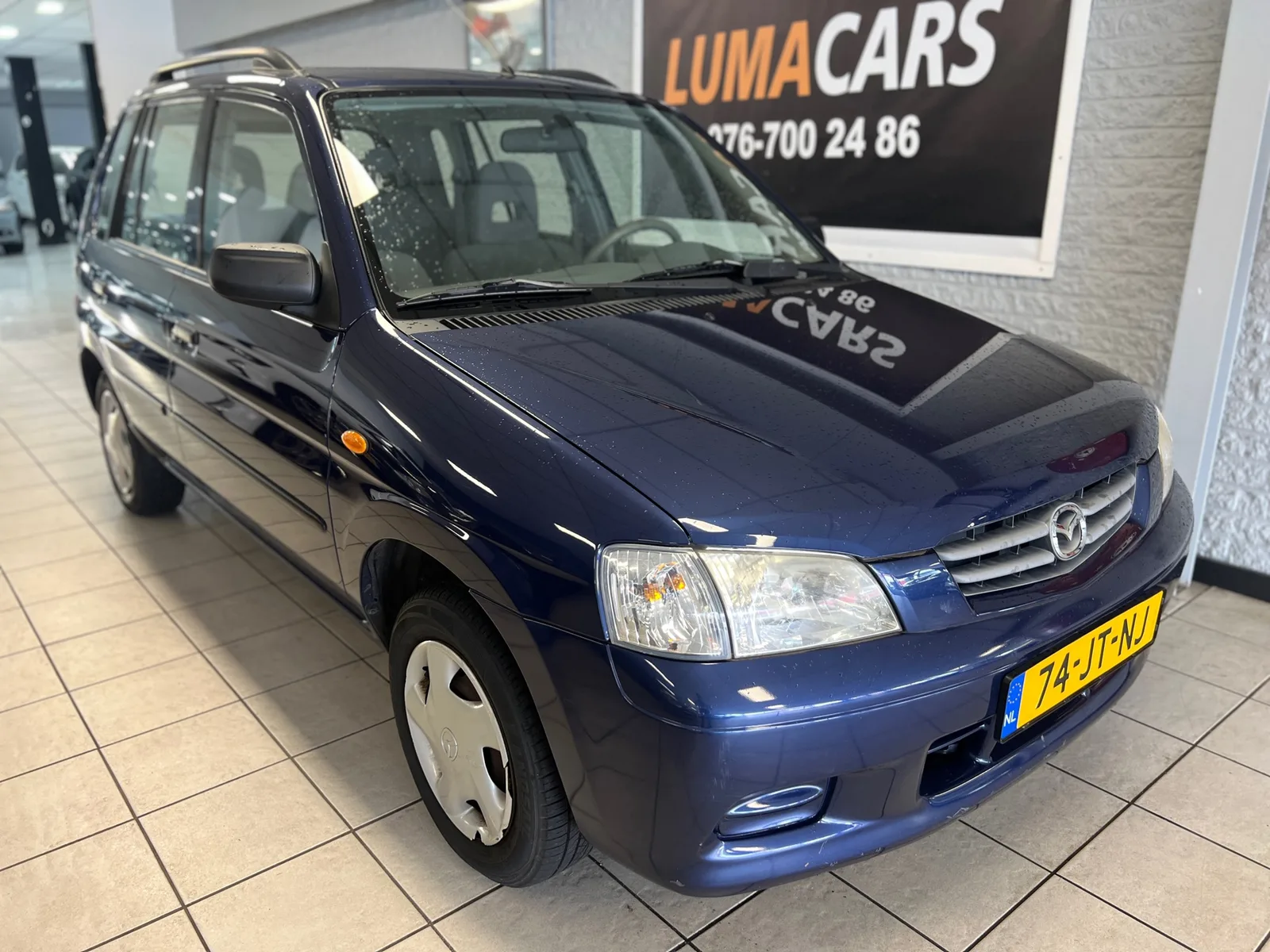 Mazda Demio (2002) — foto 1