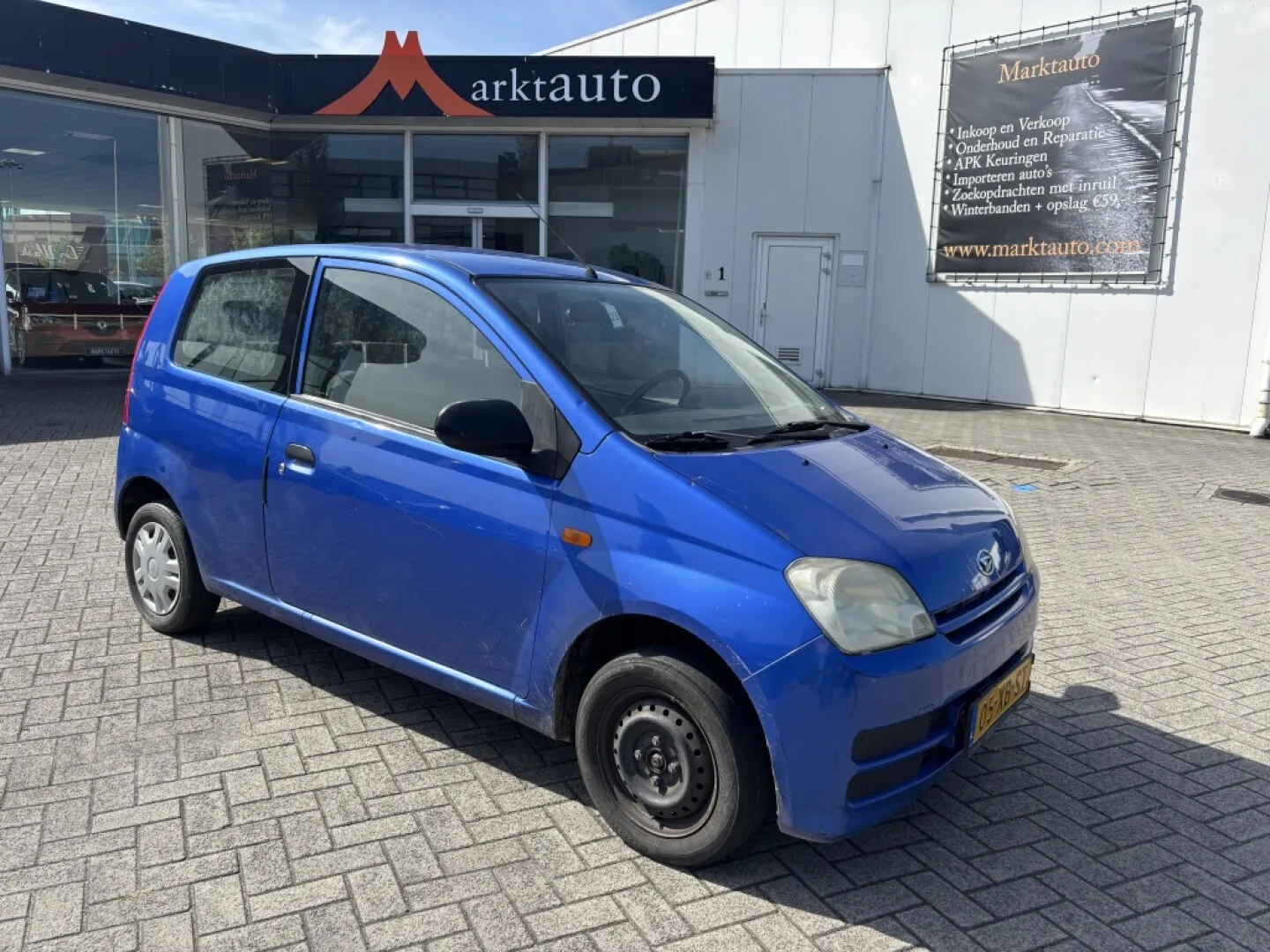 Daihatsu Cuore (2007) — foto 1