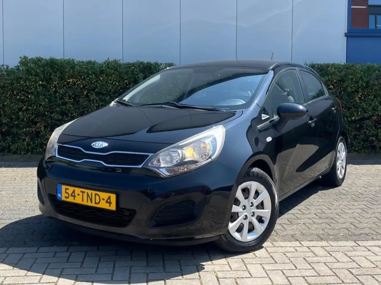 Kia Rio (2011) — foto 1