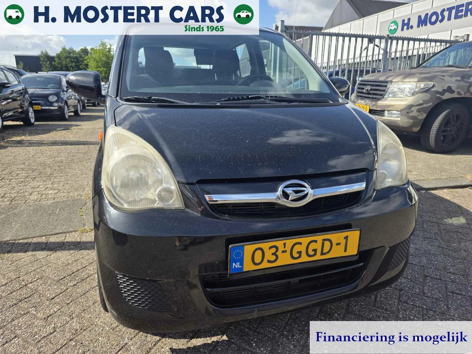 Daihatsu Cuore (2008) — foto 1