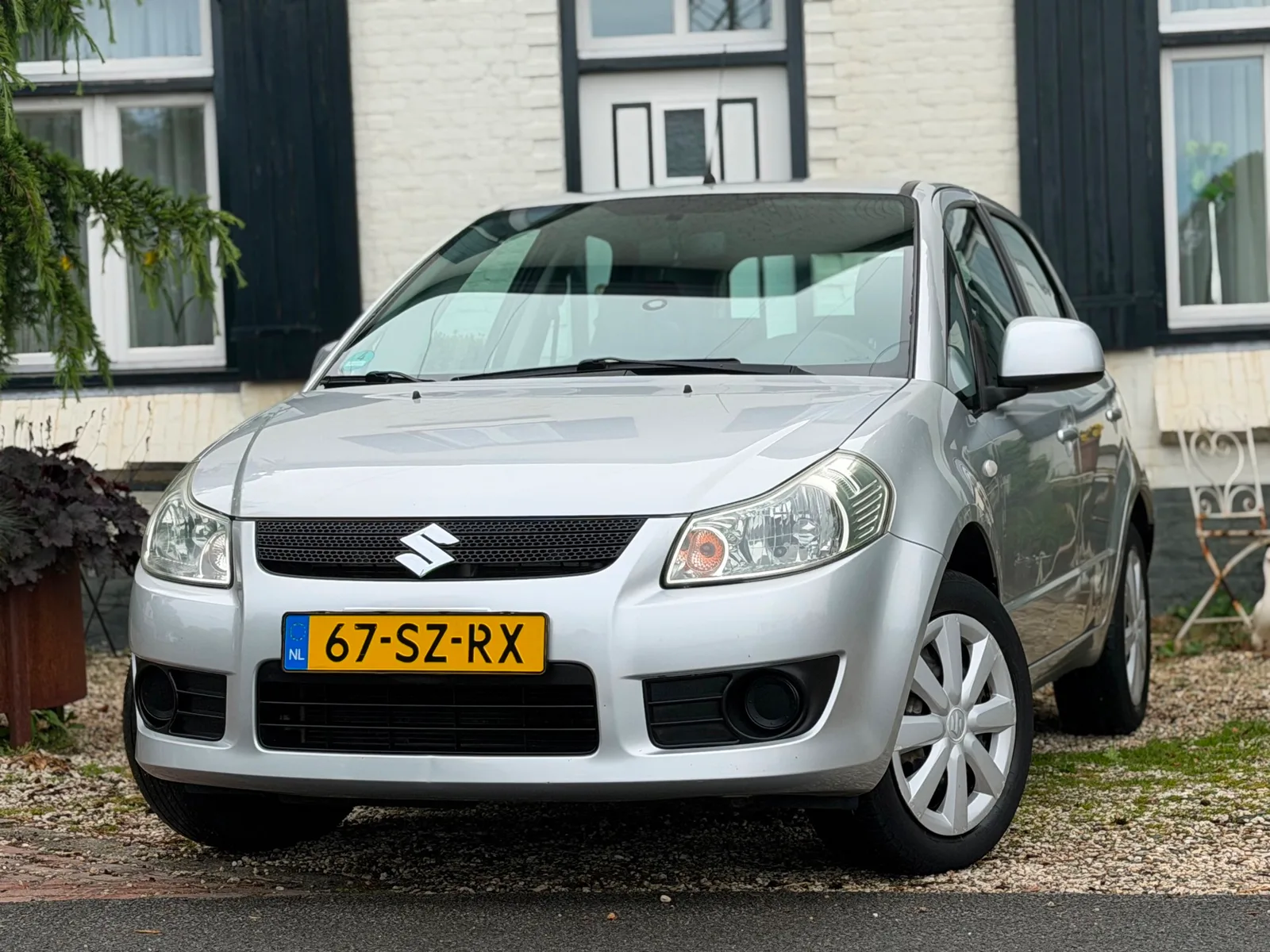 Suzuki SX4 (2006) — foto 1