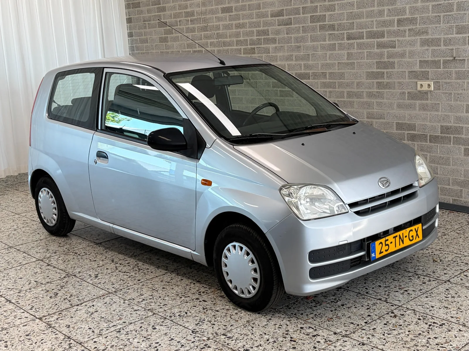 Daihatsu Cuore (2006) — foto 1