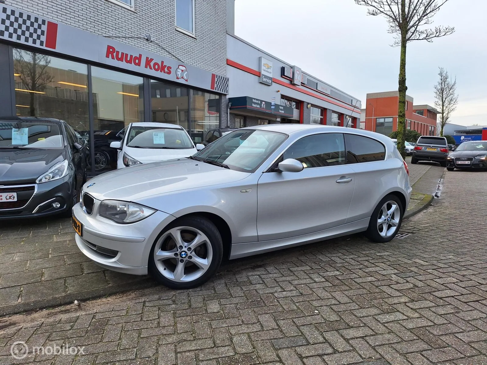 BMW 1-Serie (2009) — foto 1