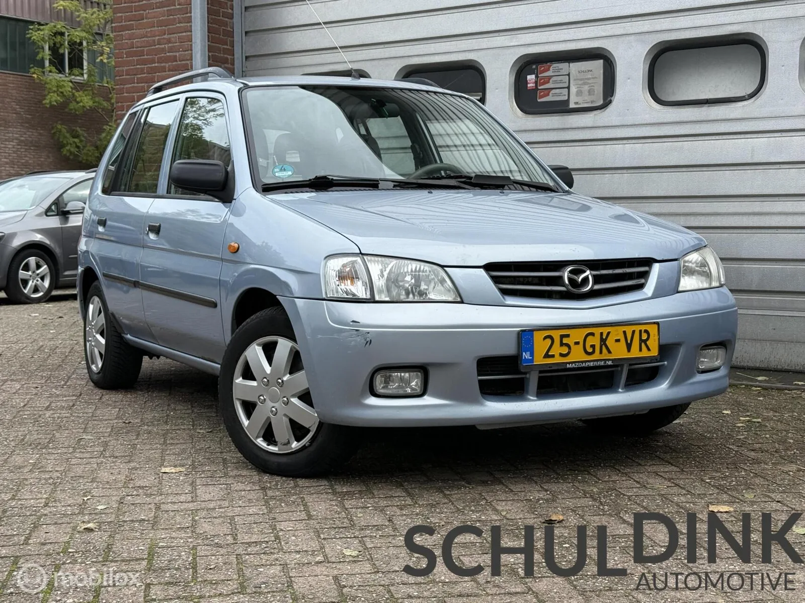 Mazda Demio (2001) — foto 1