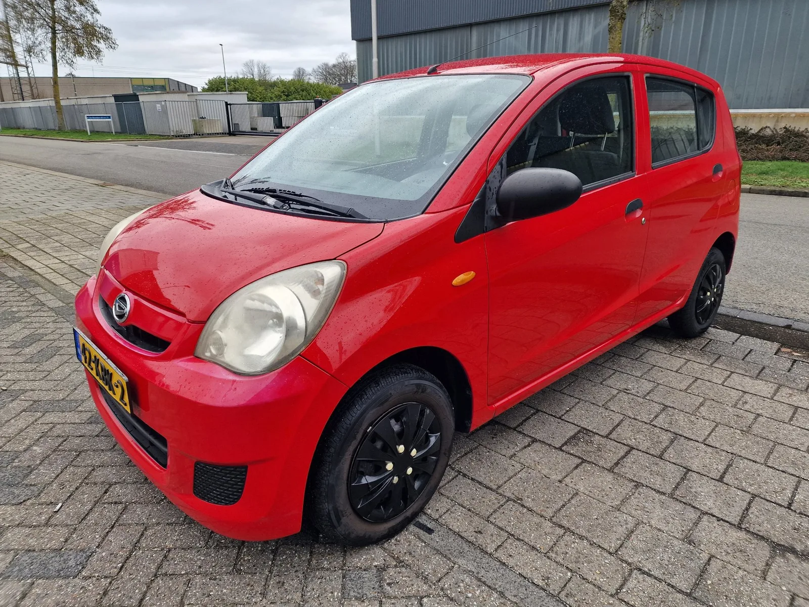 Daihatsu Cuore (2009) — foto 1