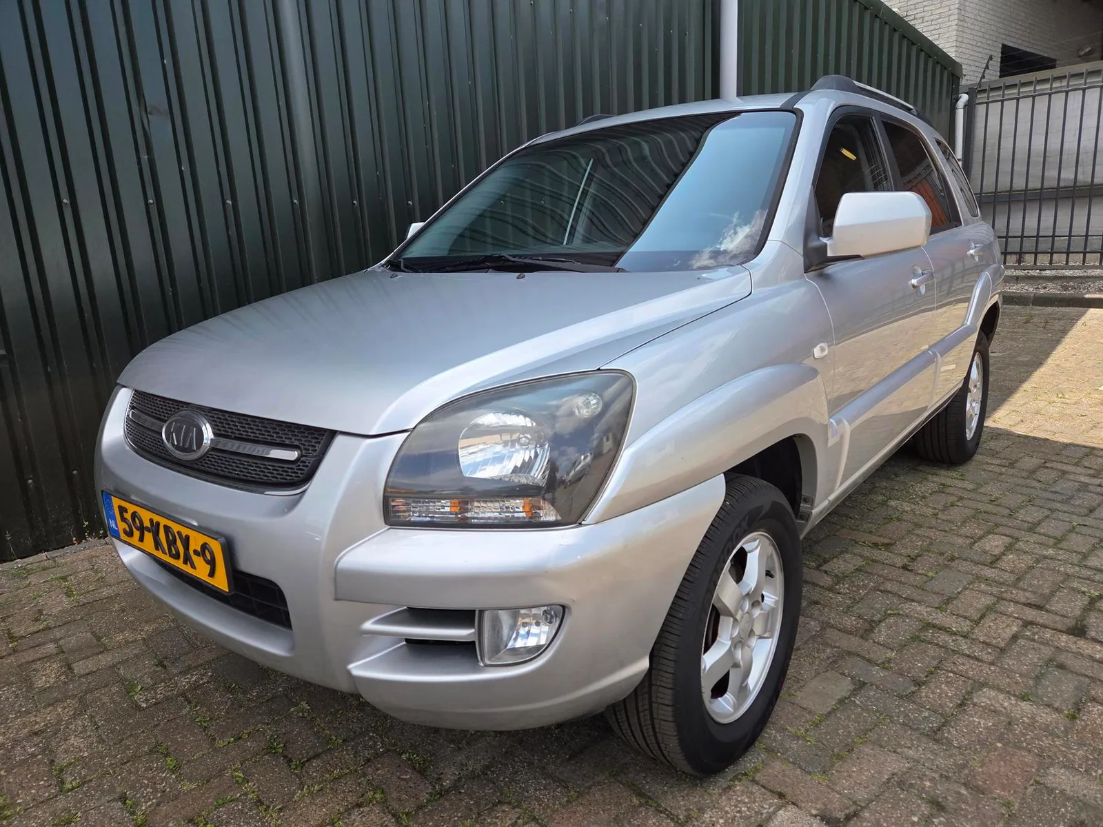 Kia Sportage (2009) — foto 1