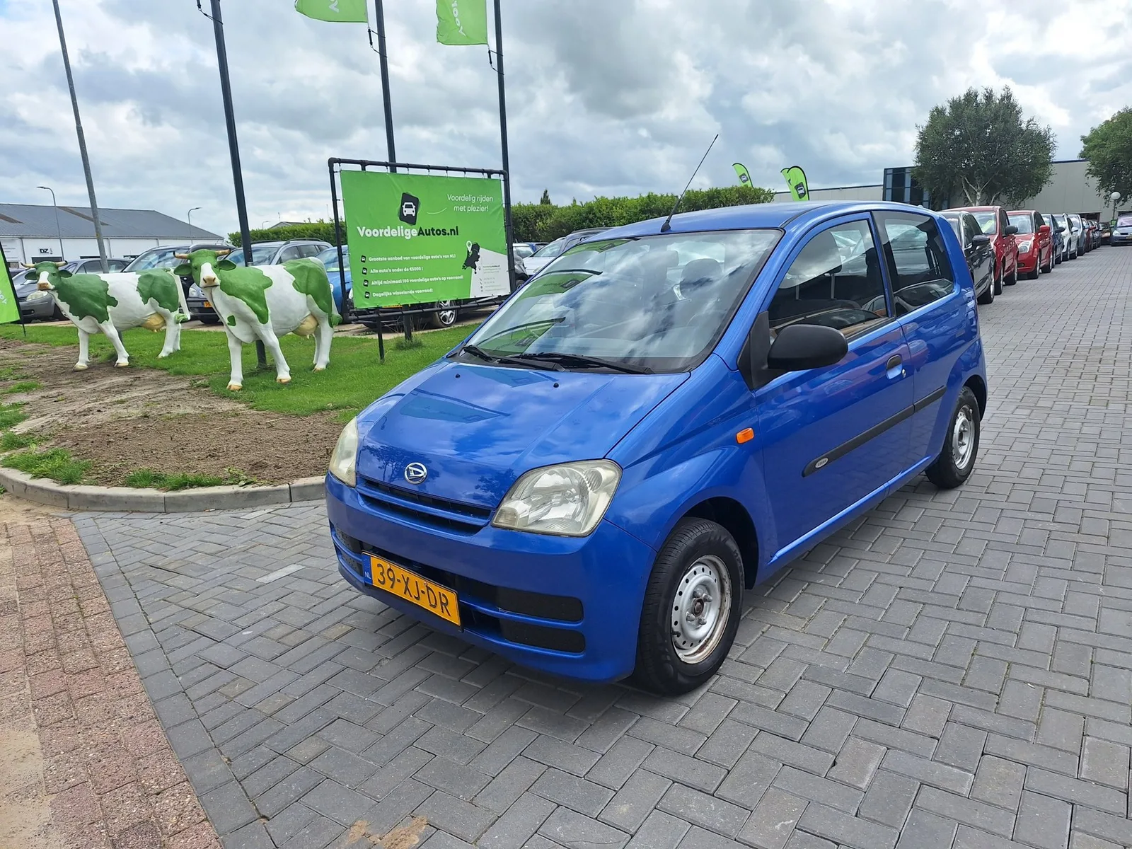 Daihatsu Cuore (2007) — foto 1